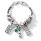 Brighton charm bracelet with silver-plated beads, crystal accents, blue stone, and Blessed, Love, Live charms on a white background