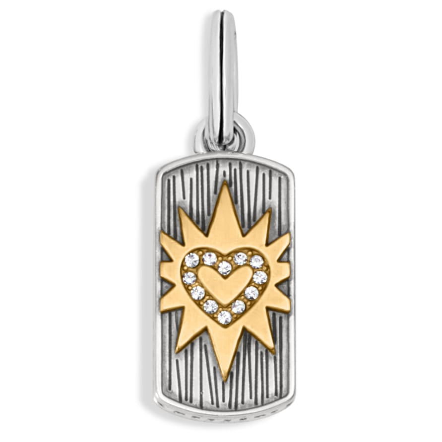 Brighton pendant charm with silver-plated tag, gold-tone starburst, and crystal heart on a white background