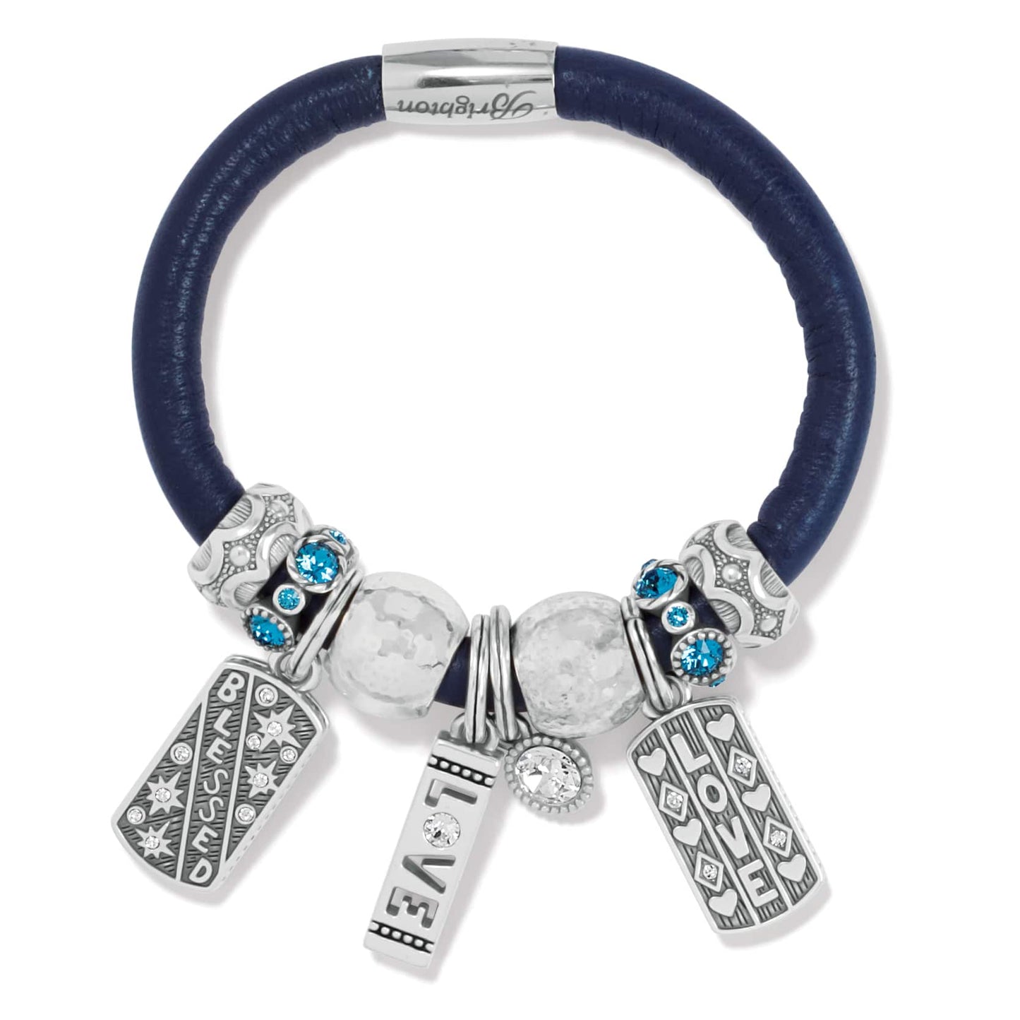 Brighton charm bracelet with navy leather band, silver-plated charms, blue crystal beads, and Love Blessed tags on a white background