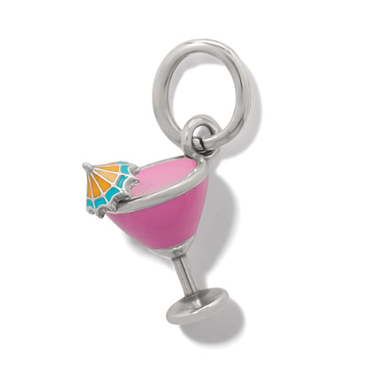 Brighton charm shaped like a pink enamel cocktail glass with orange and teal umbrella on a white background
