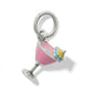 Brighton charm shaped like a pink enamel cocktail glass with yellow and blue umbrella on a white background