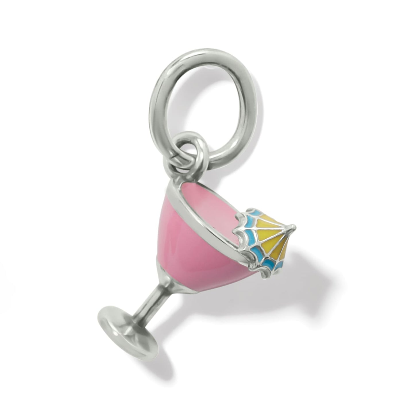 Brighton charm shaped like a pink enamel cocktail glass with yellow and blue umbrella on a white background