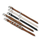 Brighton leather straps in brown, white, and black with silver-plated buckles and decorative charms on a white background