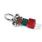 Brighton charm with silver-plated bow and amber, teal, and red crystal cube beads on a white background