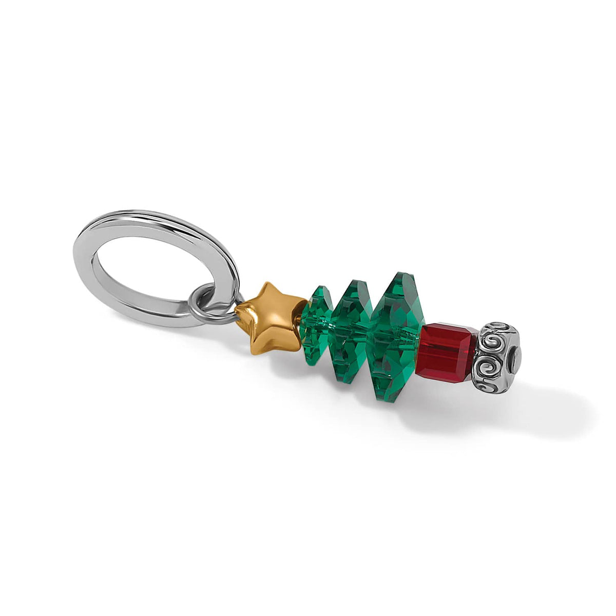 Brighton Christmas tree charm with green crystals, red crystal base, gold star, and silver-plated ring on a white background