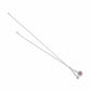 Brighton charm necklace with silver-tone chain, heart charm with red crystal, and Christmas tree charm on a white background