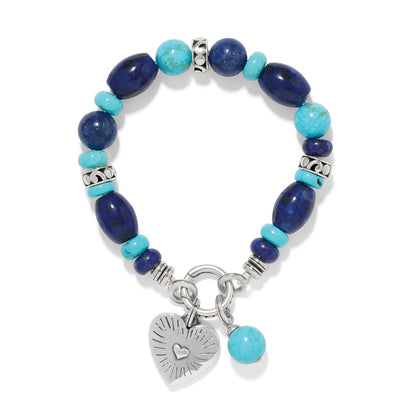 Brighton beaded bracelet with lapis lazuli and turquoise stones, silver-plated heart charm on a white background