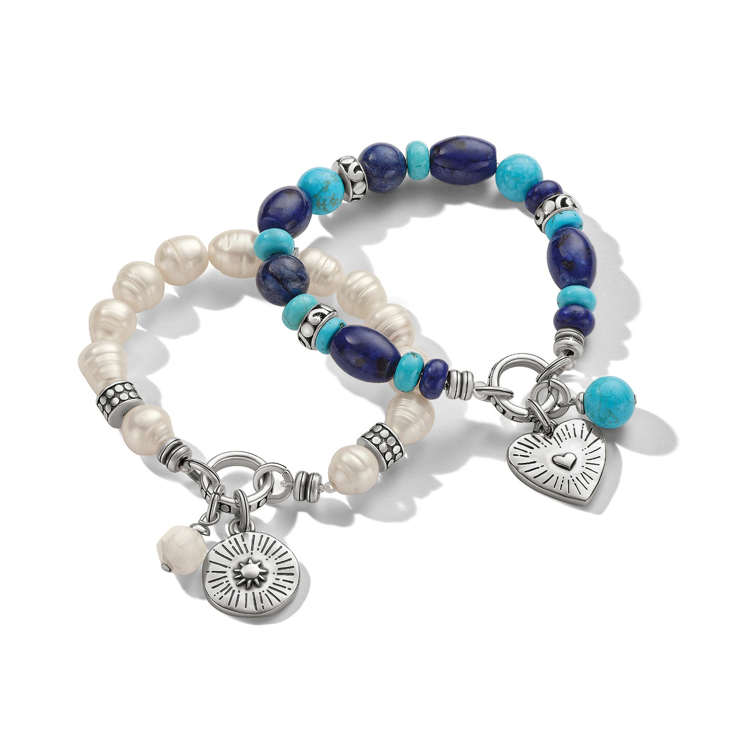 Brighton beaded bracelets with lapis, turquoise, freshwater pearls, and silver-plated heart and sun charms on a white background