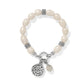 Brighton beaded bracelet with freshwater pearls, silver-plated accents, and inscribed round charm on a white background