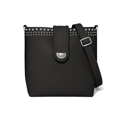 Brighton black pebbled crossbody handbag with silver-tone studded trim, medallion strap closure, and adjustable shoulder strap on a white background