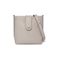 Brighton crossbody handbag in taupe pebbled leather with silver-tone studs, magnetic tab closure, and adjustable strap on a white background