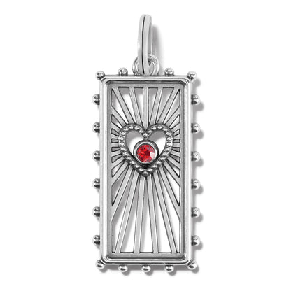 Brighton silver-plated rectangular charm with heart cutout, red crystal center, and beaded edges on a white background