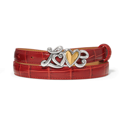 Brighton red croc-embossed leather belt with silver-tone Love buckle and gold-tone heart accent on a white background