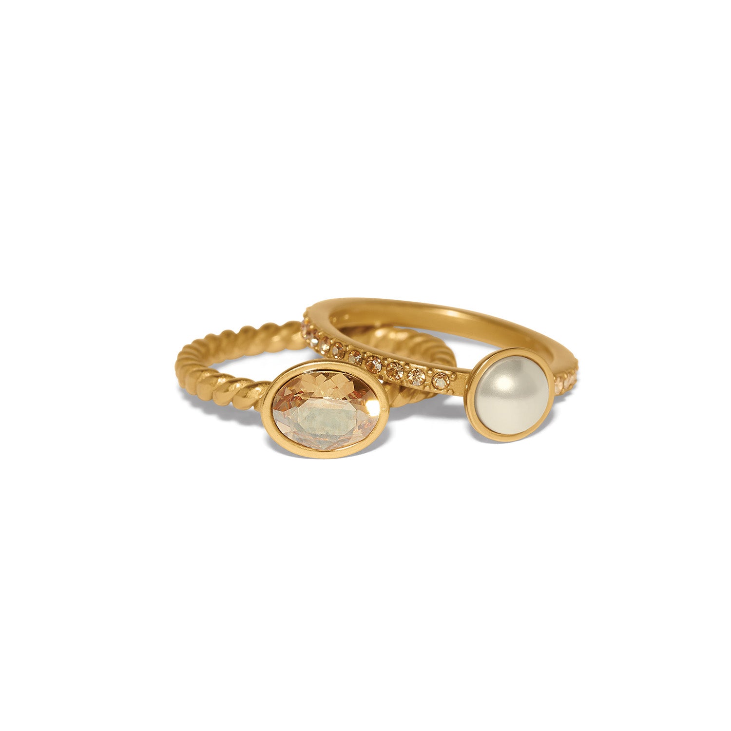 Brighton gold-plated ring set with oval crystal, glass pearl, and twisted and pavé bands on a white background