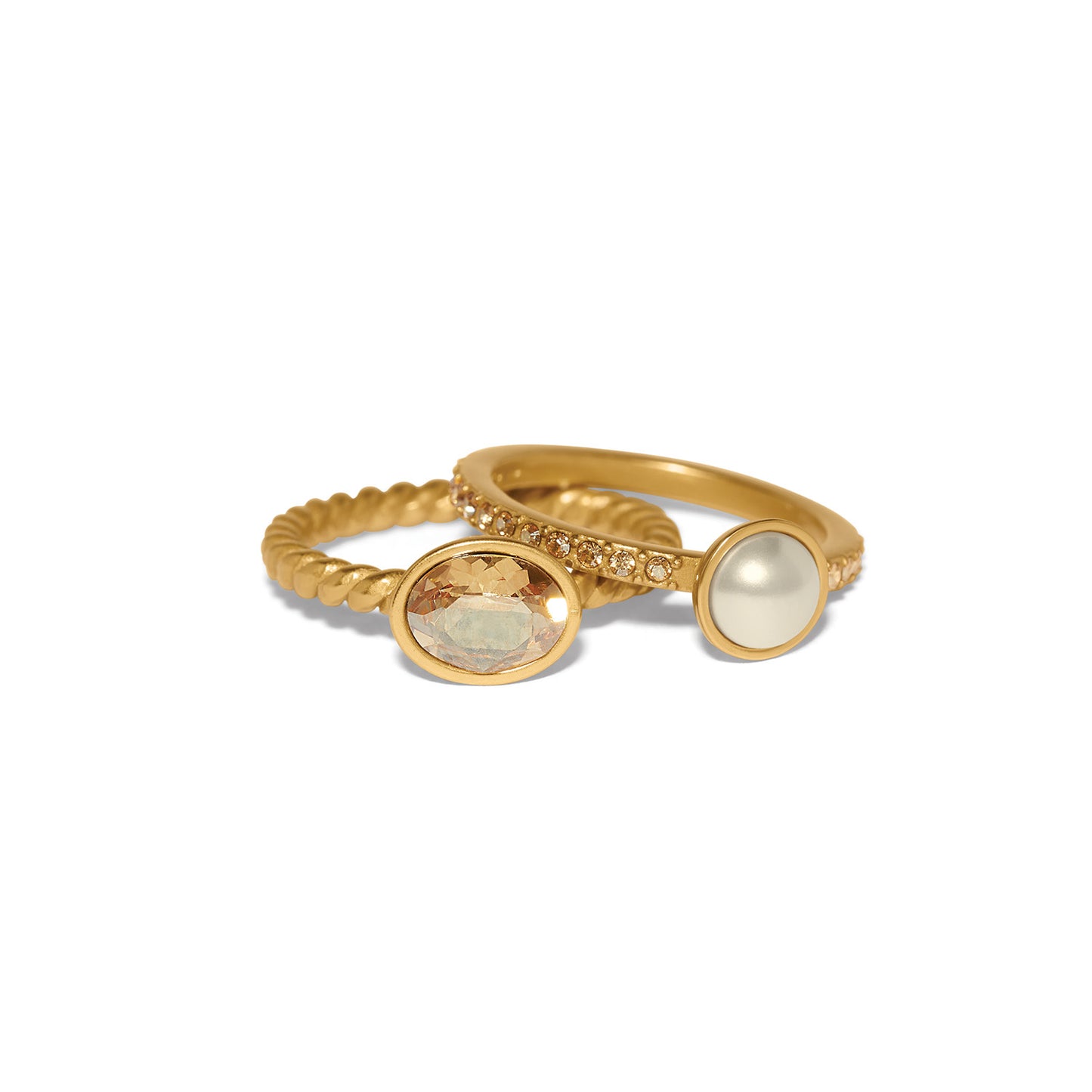 Brighton gold-plated ring set with oval crystal, glass pearl, and twisted and pavé bands on a white background