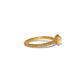 Brighton gold-plated ring with crystal-set band and glass pearl accent, shown from the side, on a white background