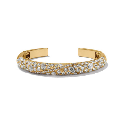 Brighton cuff bracelet with gold-plated finish and pavé fine quality crystals in varied sizes on a white background