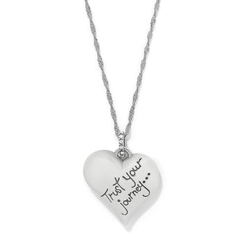 Brighton heart pendant necklace with silver-plated finish, engraved Trust Your Journey, and crystal accents on a white background