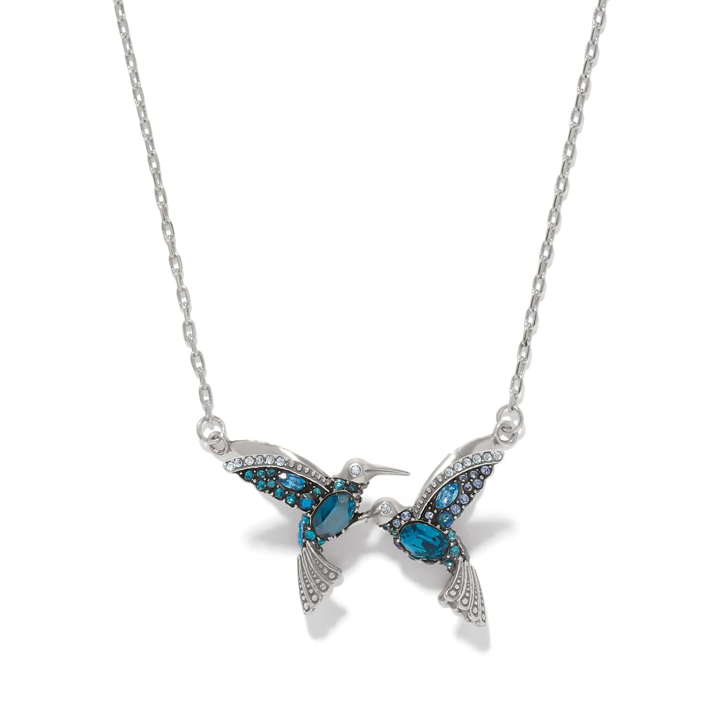 Brighton silver-plated hummingbird necklace with blue crystal wings and bodies on a white background