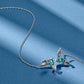 Brighton silver-plated hummingbird pendant necklace with blue and clear crystal accents on a blue background