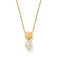 Brighton pendant necklace with gold-plated circular disc and baroque pearl drop on delicate chain on a white background