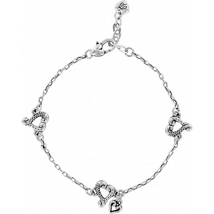 Brighton charm bracelet with silver-plated heart charms and lobster clasp closure on a white background