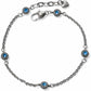 Brighton silver-plated chain bracelet with blue crystal floral stations, lobster clasp, and heart charm on a white background