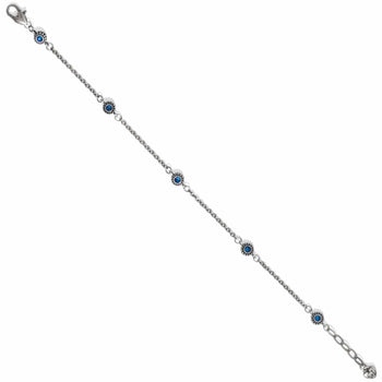 Brighton silver-plated bracelet with blue crystal stations and lobster clasp on a white background