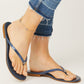 Model wearing Brighton blue thong sandals with silver-plated heart accent at the toe post