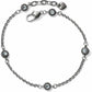 Brighton silver-plated chain bracelet with four light blue crystal floral stations and lobster clasp on a white background