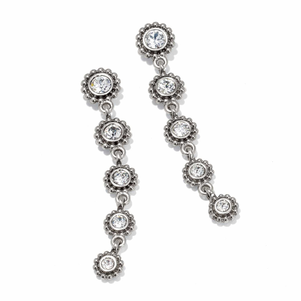 Brighton silver-plated drop earrings with linked floral-shaped stations and crystal centers on a white background