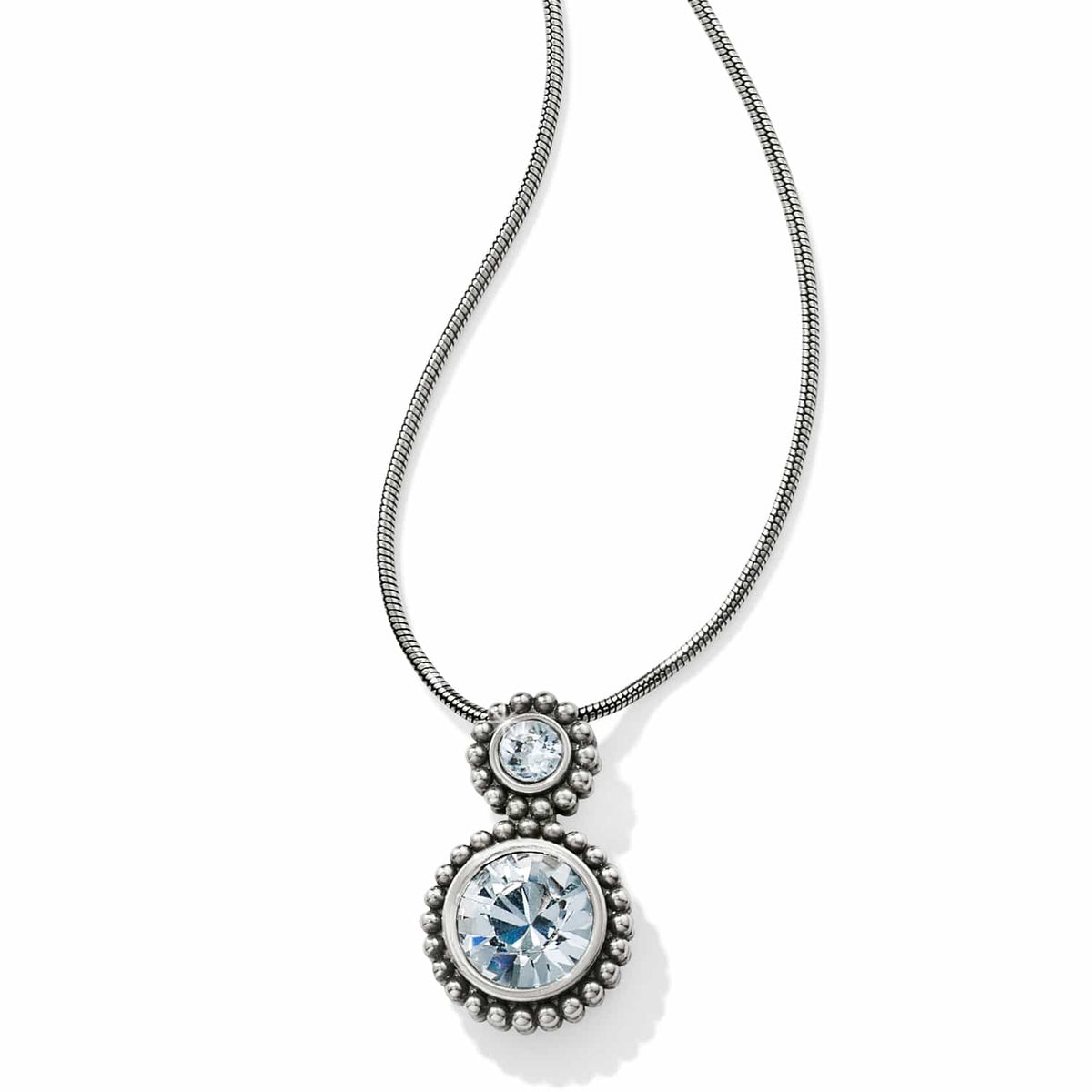 Brighton pendant necklace with two round crystals in silver-plated beaded settings on a snake chain on a white background