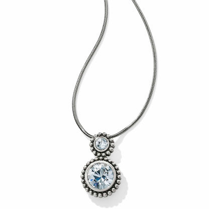 Brighton pendant necklace with two round crystals in silver-plated beaded settings on a snake chain on a white background