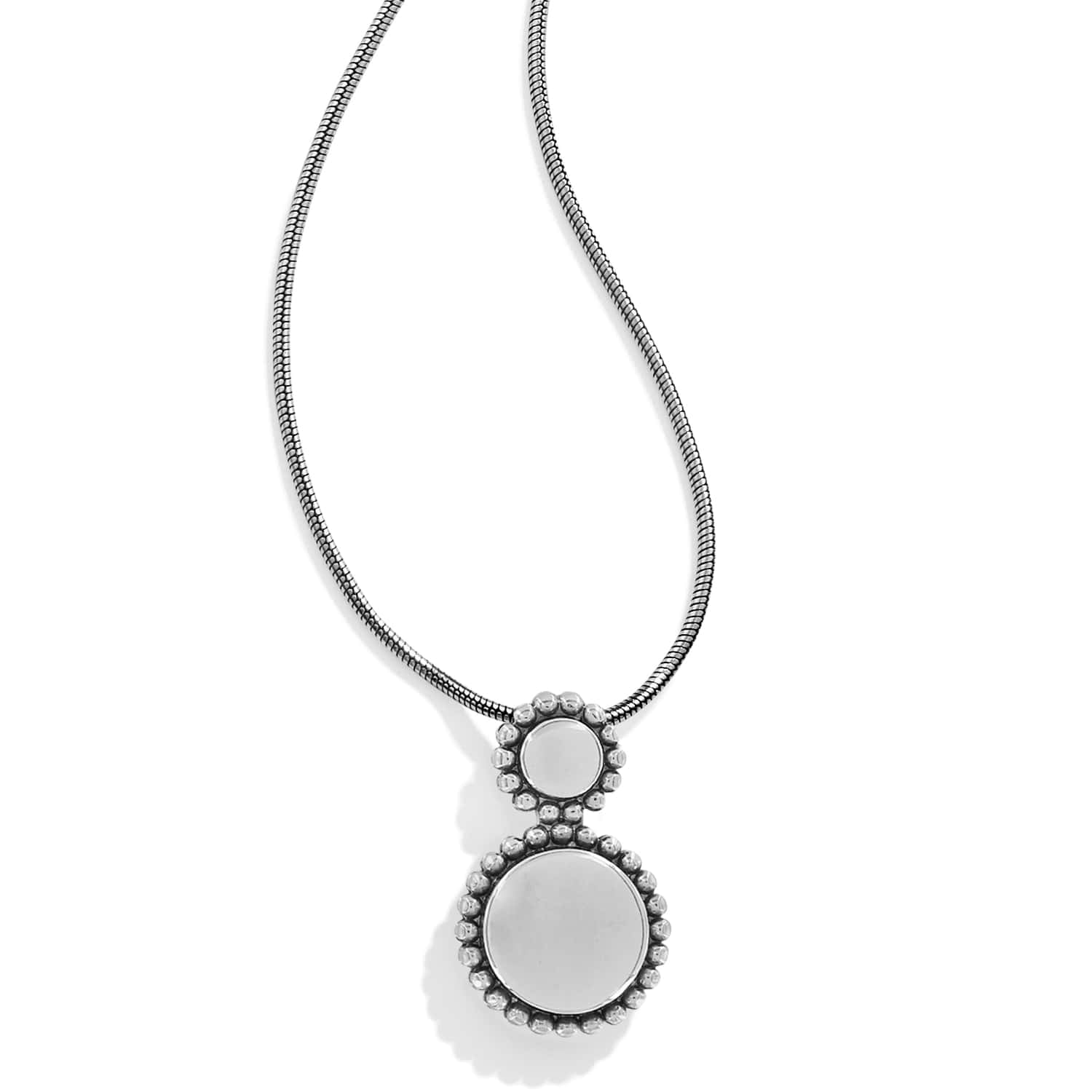 Brighton pendant necklace with silver-plated double round medallions, beaded borders, and snake chain on a white background