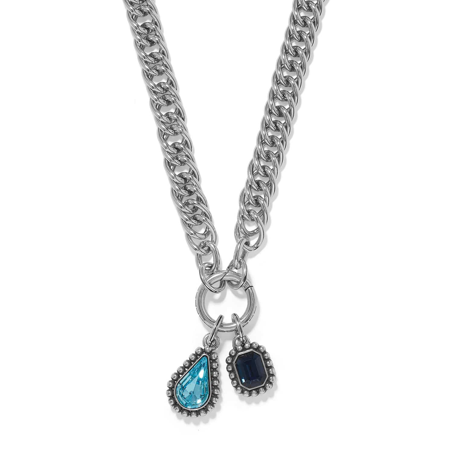Brighton silver-plated curb chain necklace with aqua teardrop and blue emerald-cut crystal charms on a white background