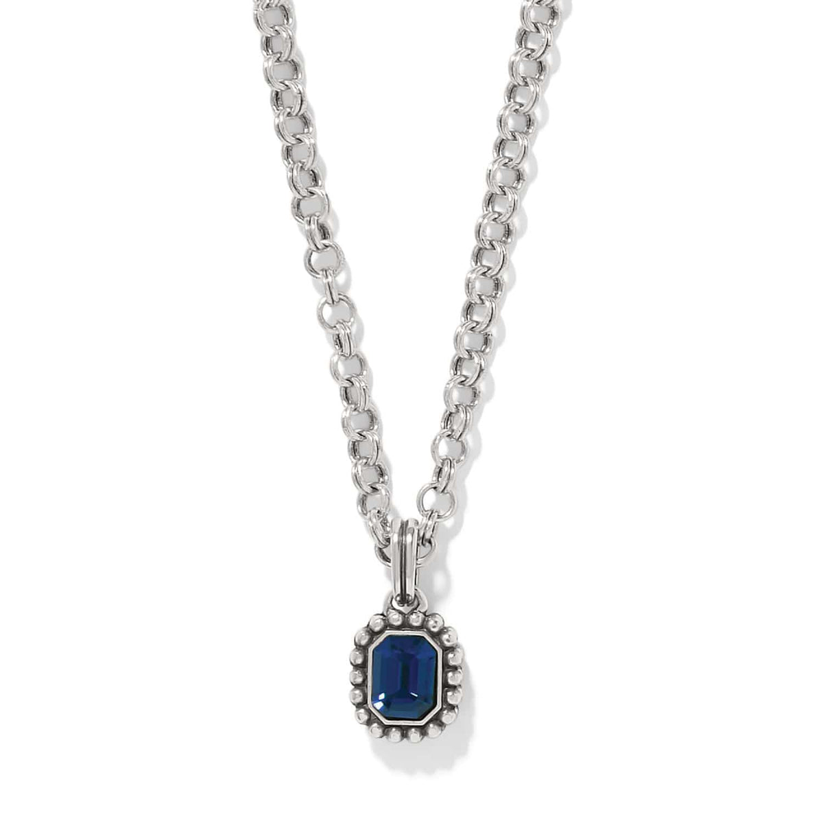 Brighton pendant necklace with emerald-cut blue crystal and beaded silver-plated frame on a white background