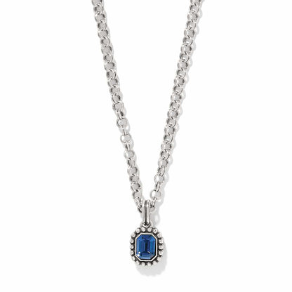 Brighton pendant necklace with blue crystal in silver-plated beaded frame on rolo chain on a white background