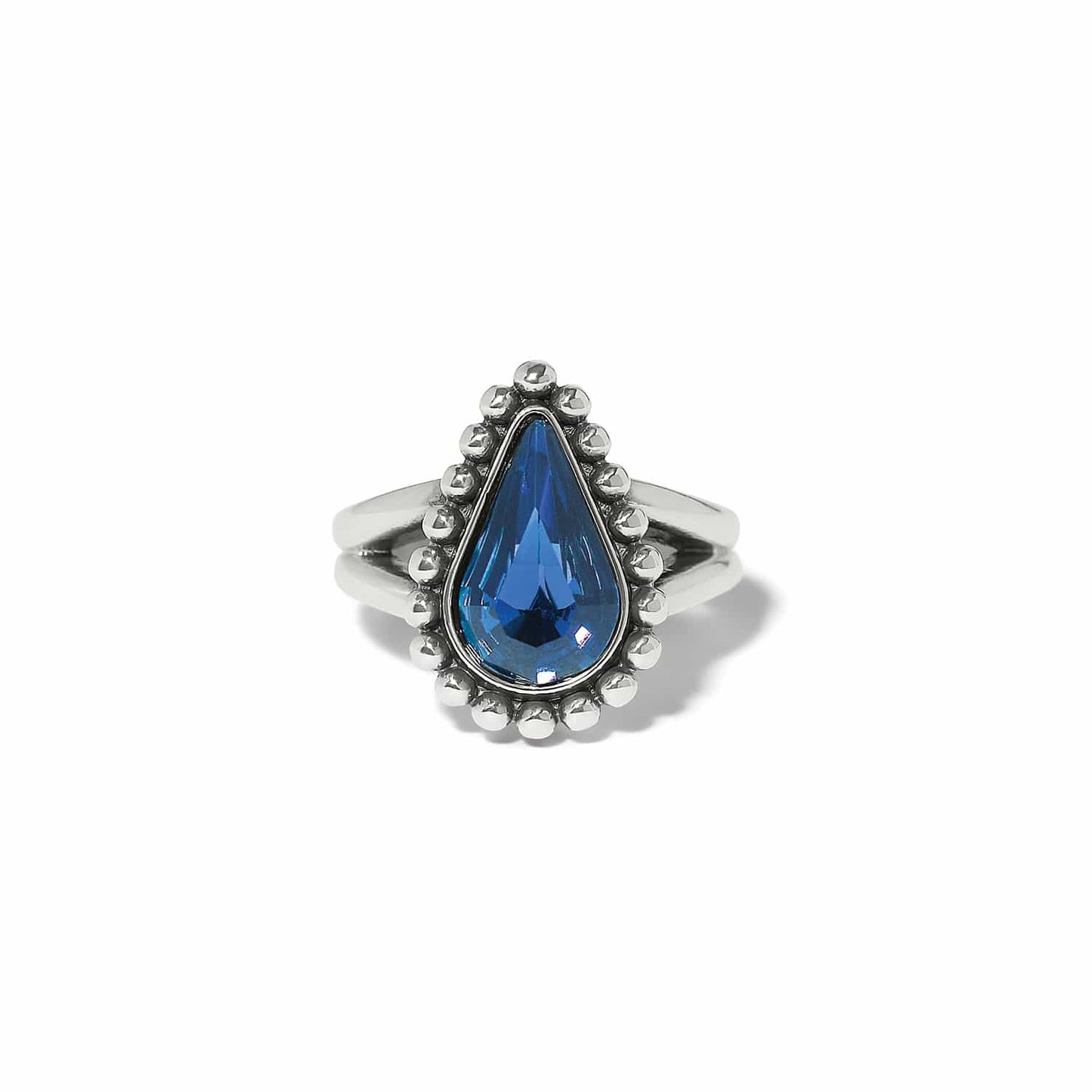 Brighton ring with blue teardrop crystal and silver-plated beaded halo on split band on a white background