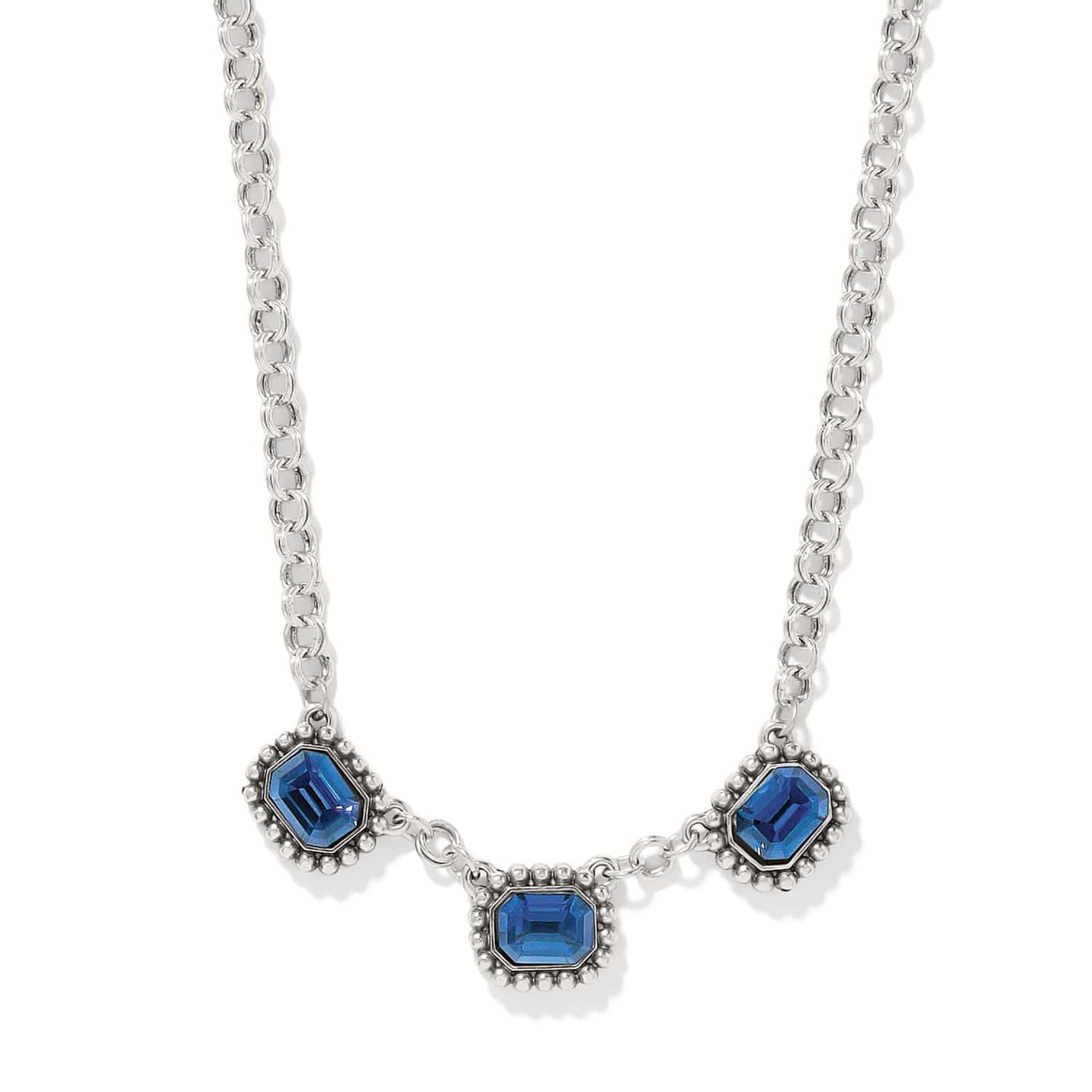 Brighton necklace with three blue emerald-cut crystals and beaded silver-plated frames on a white background