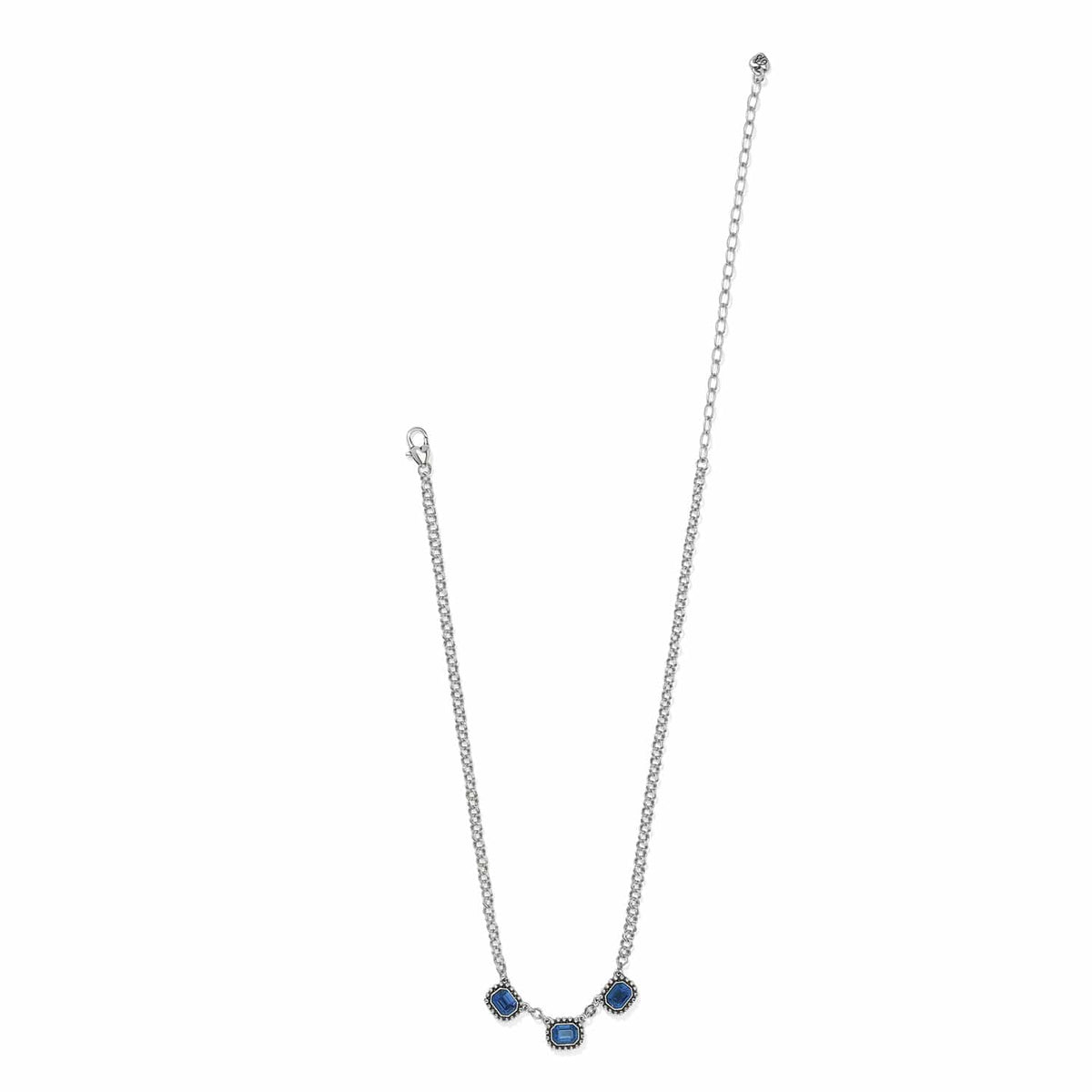 Brighton silver-plated necklace with three blue crystal stations and lobster clasp on a white background