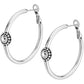 Brighton hoop earrings with silver-plated finish and round crystal medallion accents with beaded trim on a white background