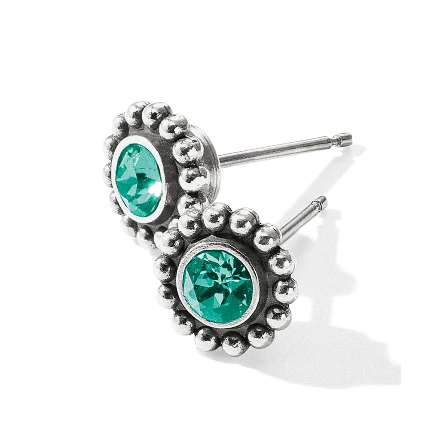 Brighton stud earrings with green crystals and silver-plated beaded edges on a white background