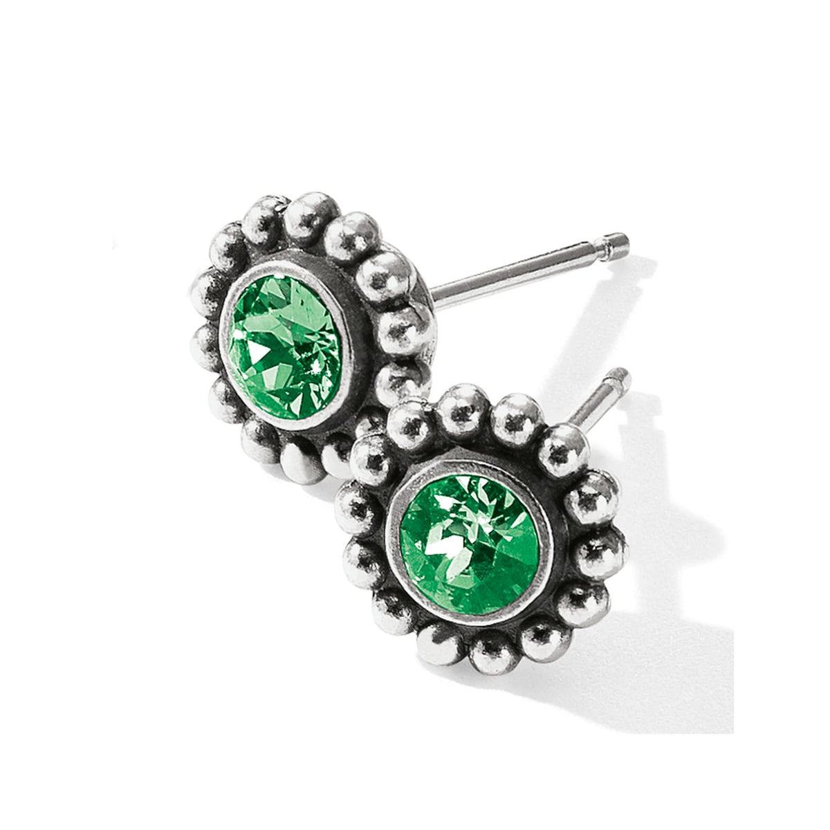 Brighton stud earrings with green crystals and silver-plated beaded edges on a white background
