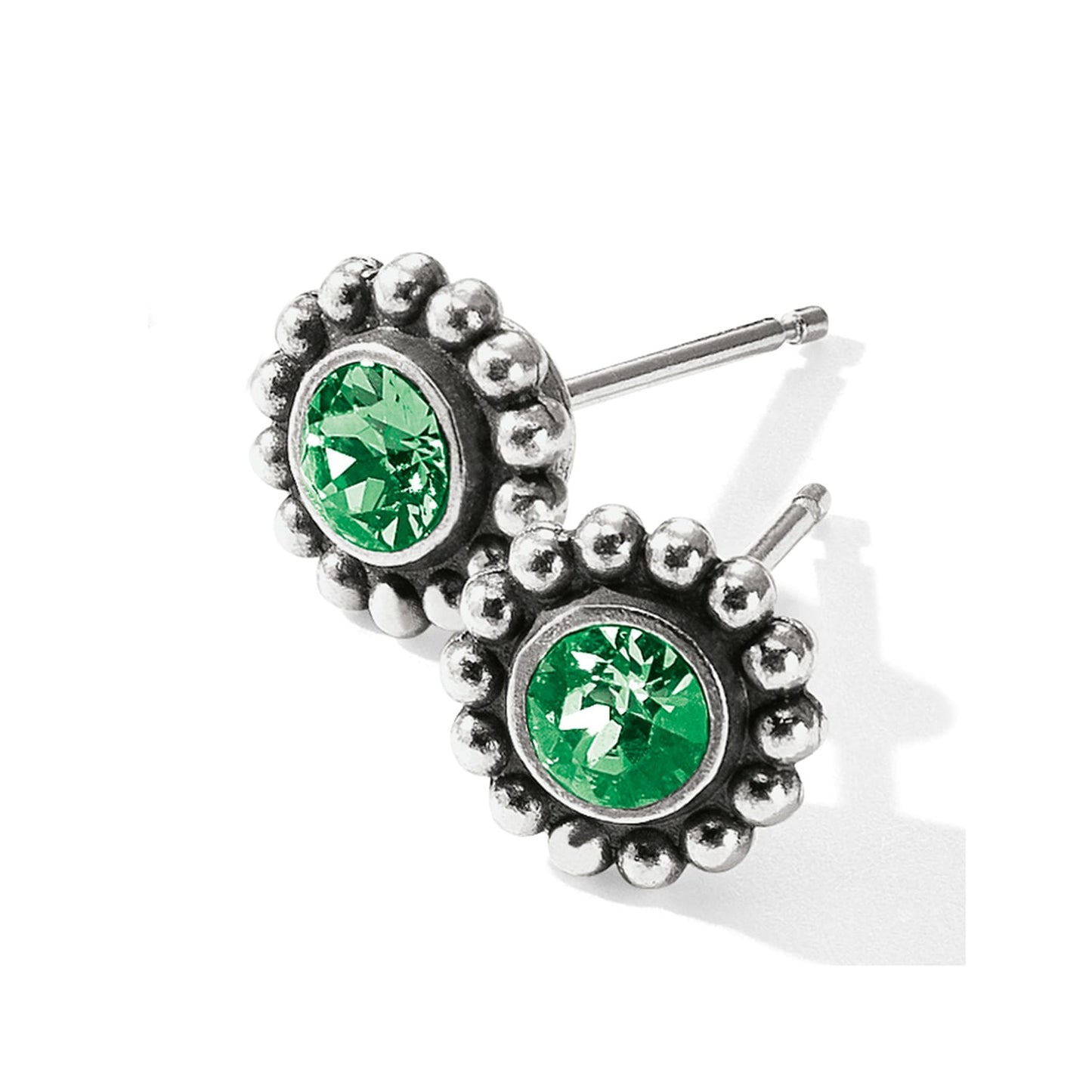 Brighton stud earrings with green crystals and silver-plated beaded edges on a white background