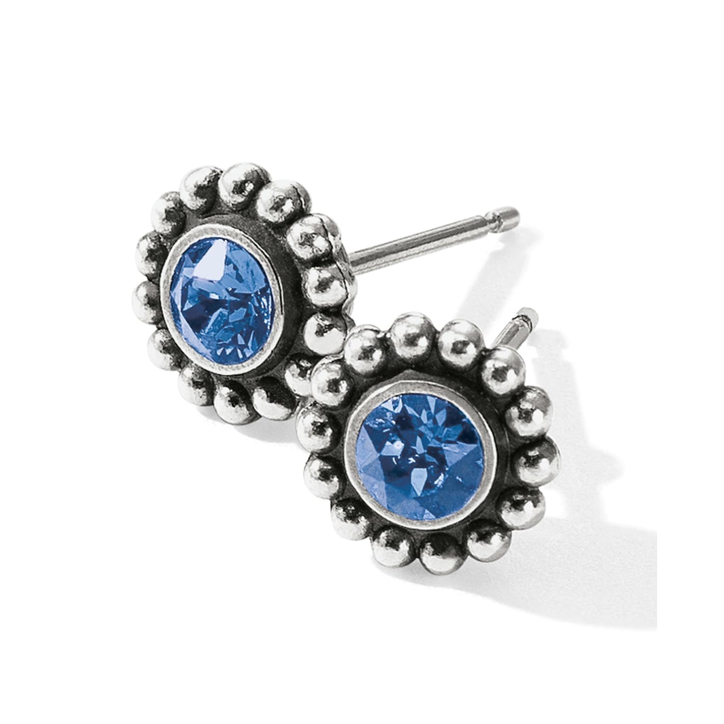 Brighton stud earrings with blue crystals and silver-plated beaded edges on a white background