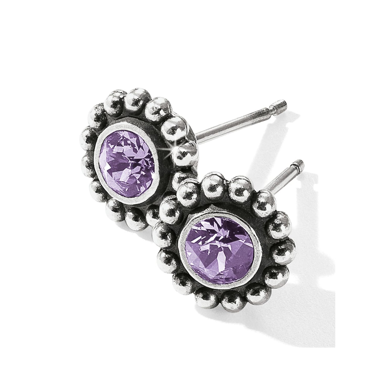 Brighton stud earrings with purple crystals and silver-plated beaded borders on a white background