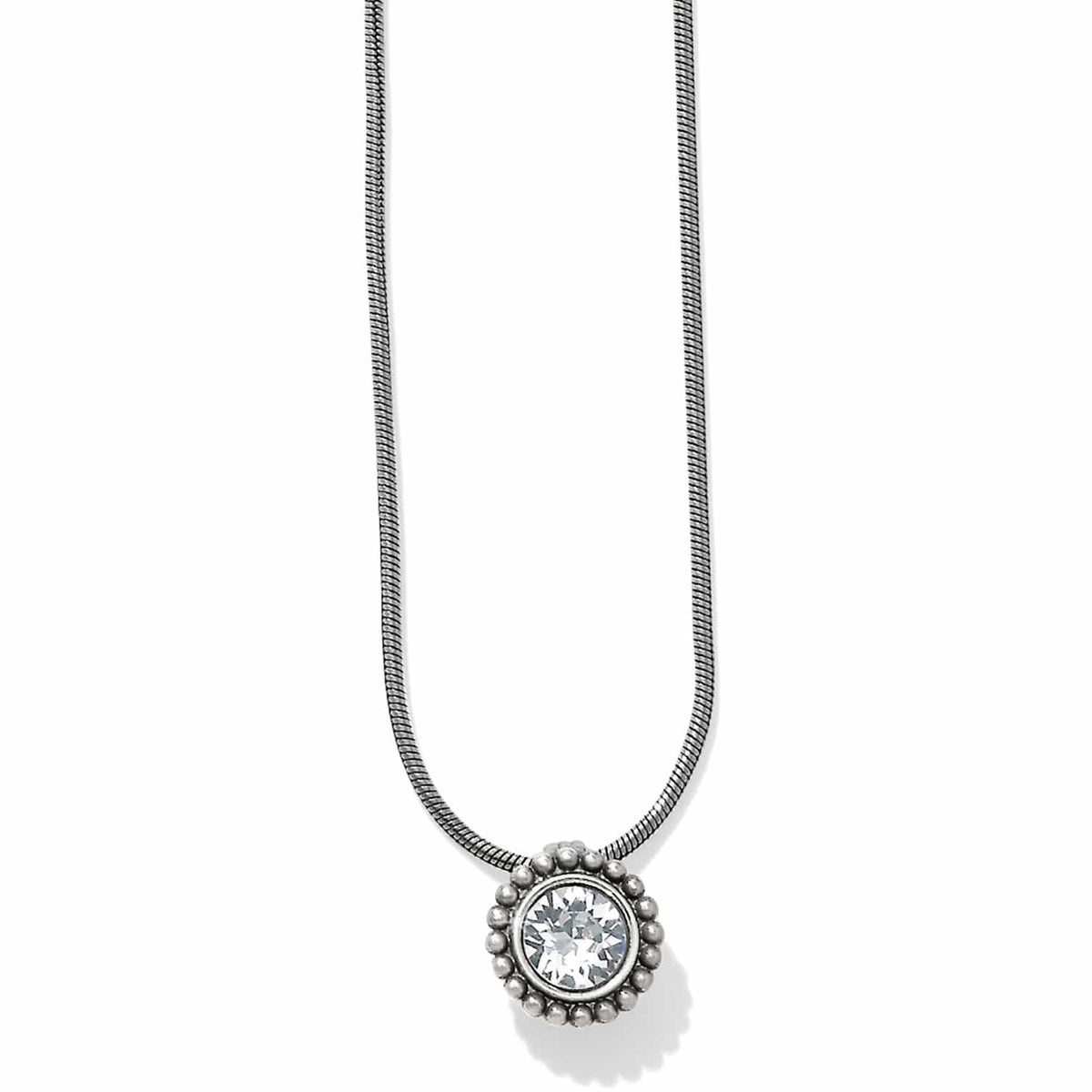 Brighton pendant necklace with round crystal centerpiece, silver-plated beaded frame, and snake chain on a white background