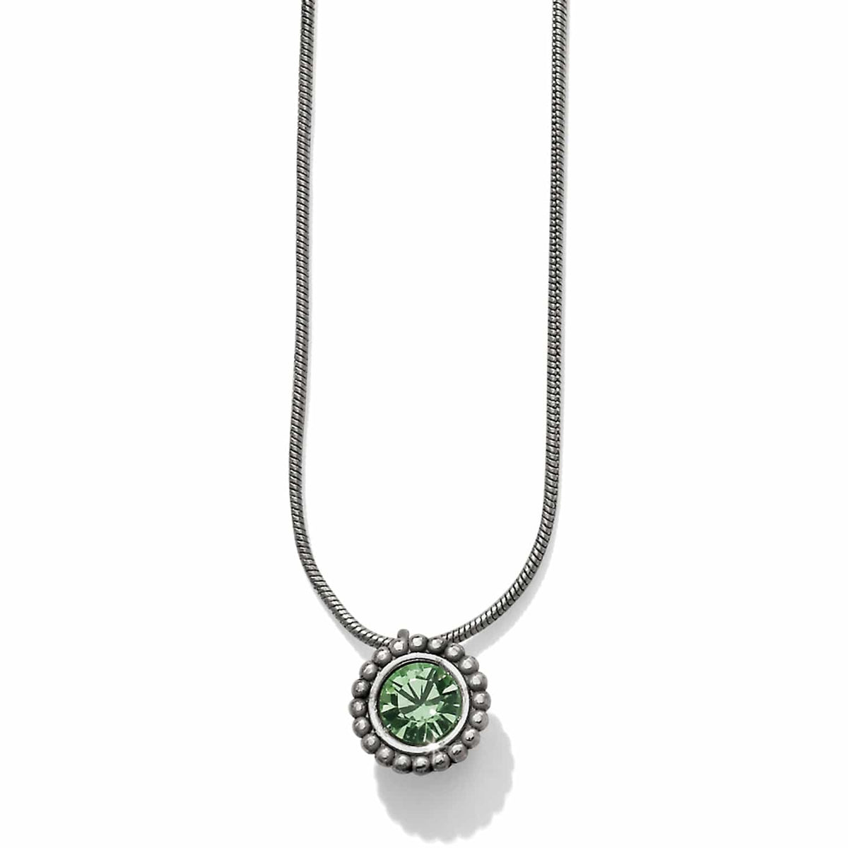 Brighton pendant necklace with green crystal and silver-plated beaded frame on snake chain on a white background