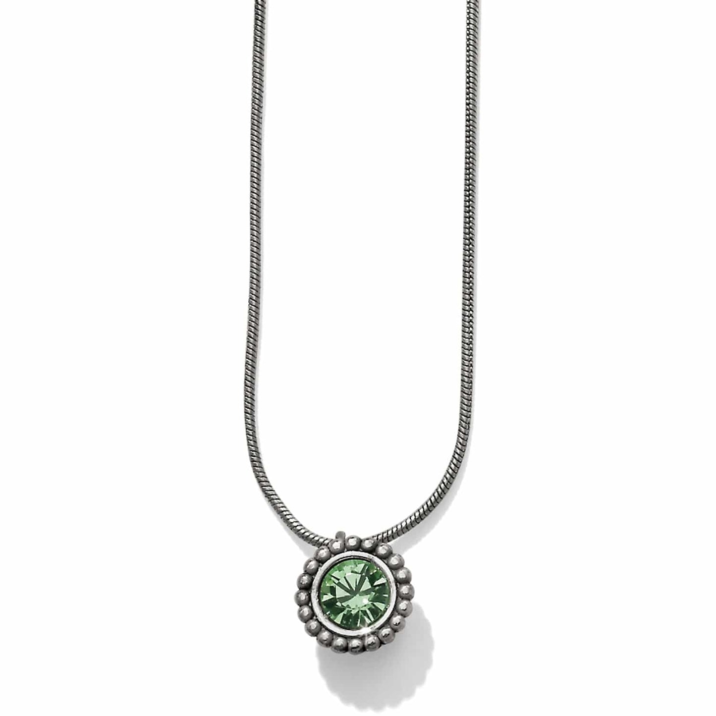 Brighton pendant necklace with green crystal and silver-plated beaded frame on snake chain on a white background