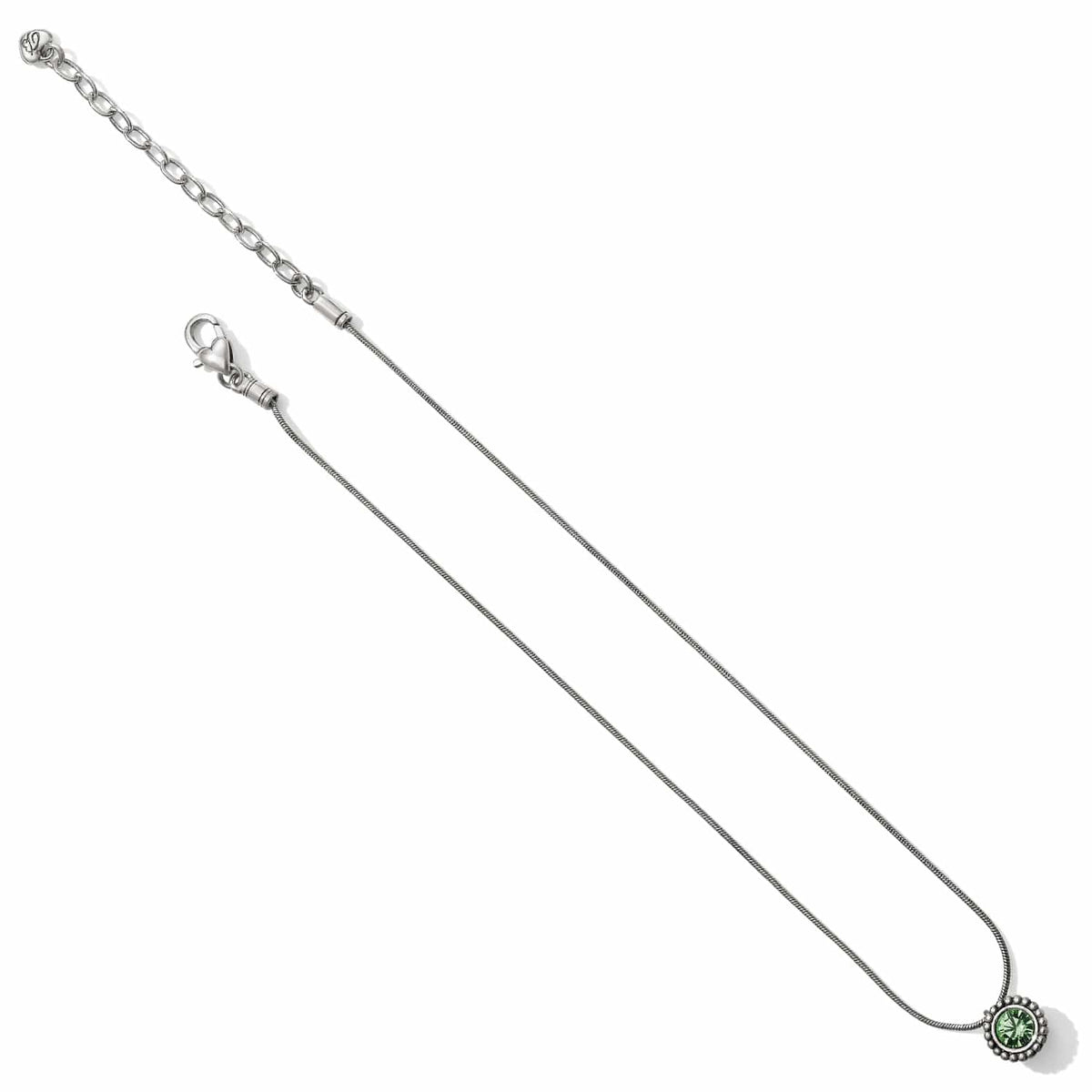 Brighton silver-plated pendant necklace with green crystal, snake chain, and adjustable extender on a white background